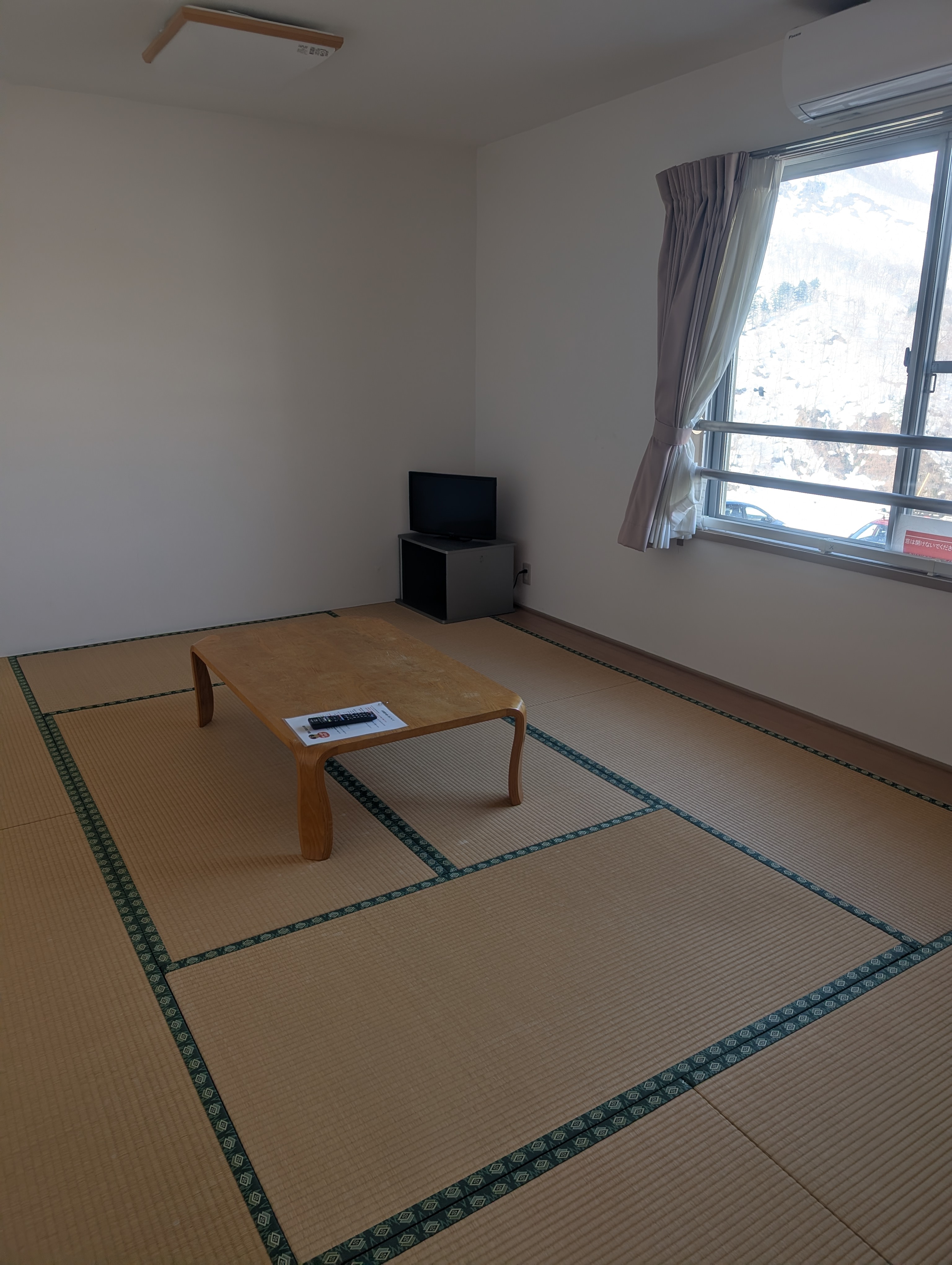 A simple room at the accommodation near Okutadami Maruyama